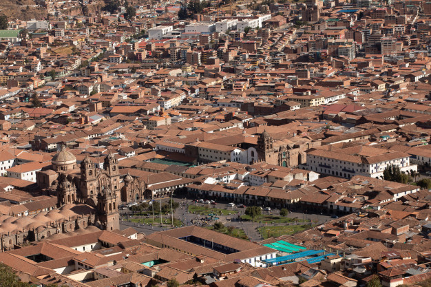 Aerial view of Cusco city center with historic buildings.
