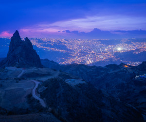 City lights and mountain at dusk from above.