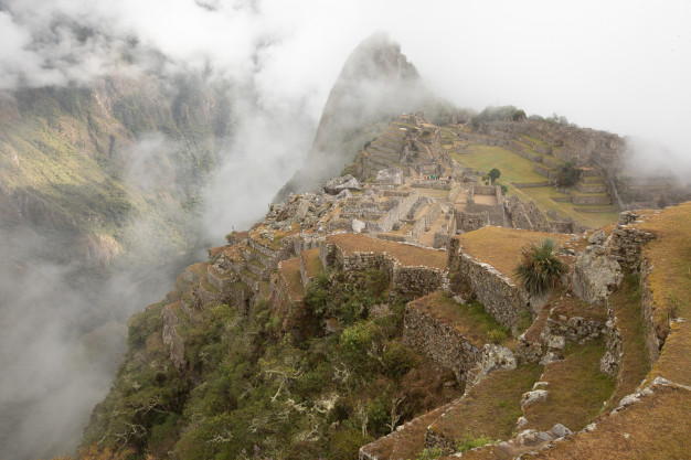 Misty Machu Picchu ancient Incan ruins in Peru.