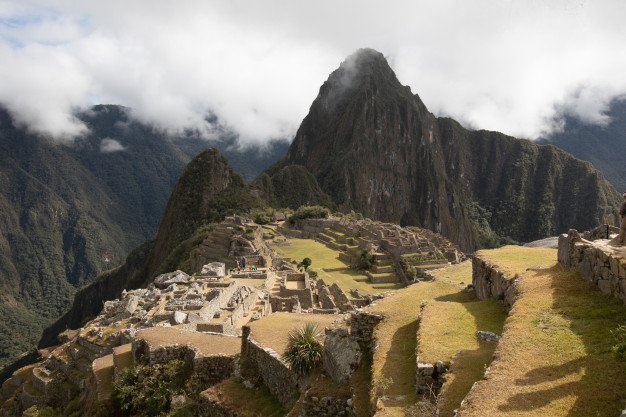 Machu Picchu ruins with Huayna Picchu mountain, Peru.
