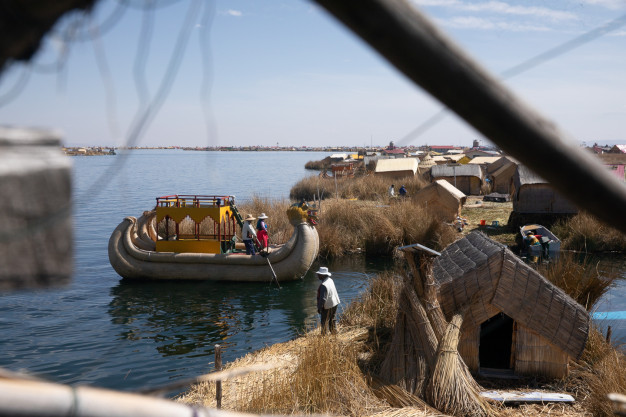 Traditional reed boat and homes, Uros Islands, Peru.