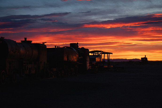 Sunset over abandoned train cemetery