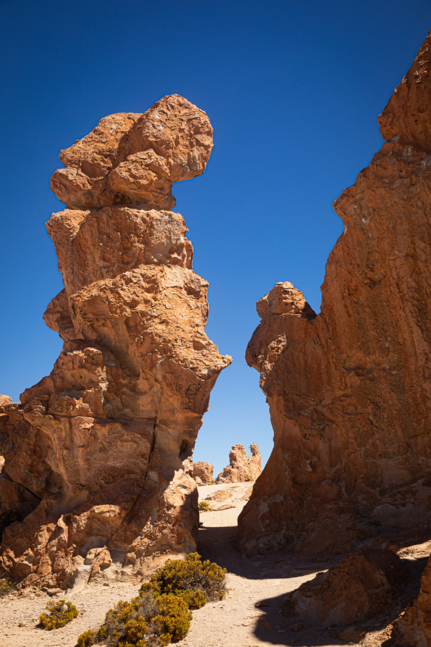 Rock formations under clear blue sky.