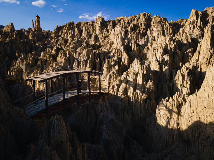 Viewpoint over jagged rock formations at sunset.