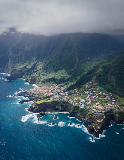 Aerial view of coastal village on cloudy day