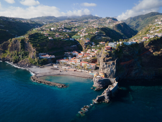 Coastal town with cliffs and beach aerial view